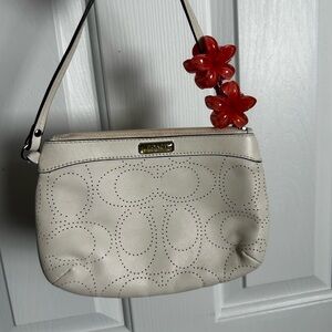 Coach Cream Perforated Wristlet with Red Floral Accent